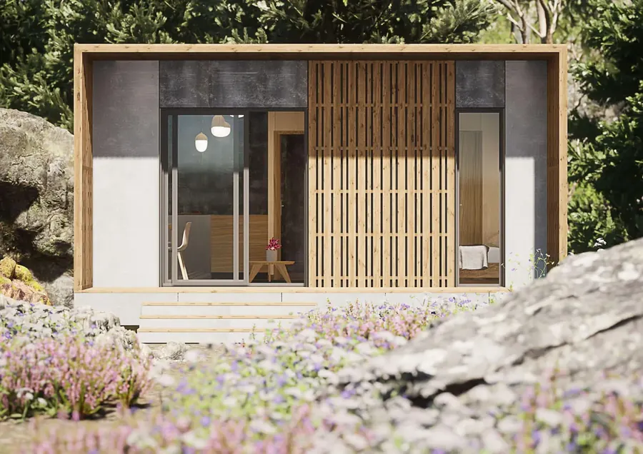Façade d'un studio bois ACMT : baie vitrée coulissante, claire-voie bois et fenêtre de la chambre